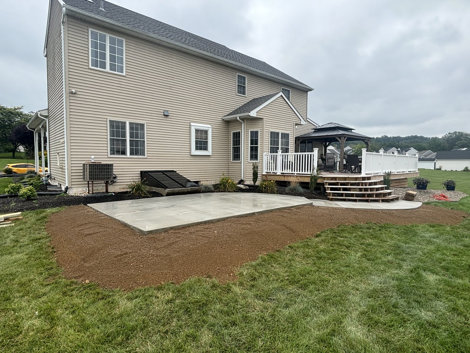 Outdoor patio installation completed by T-Bones Concrete