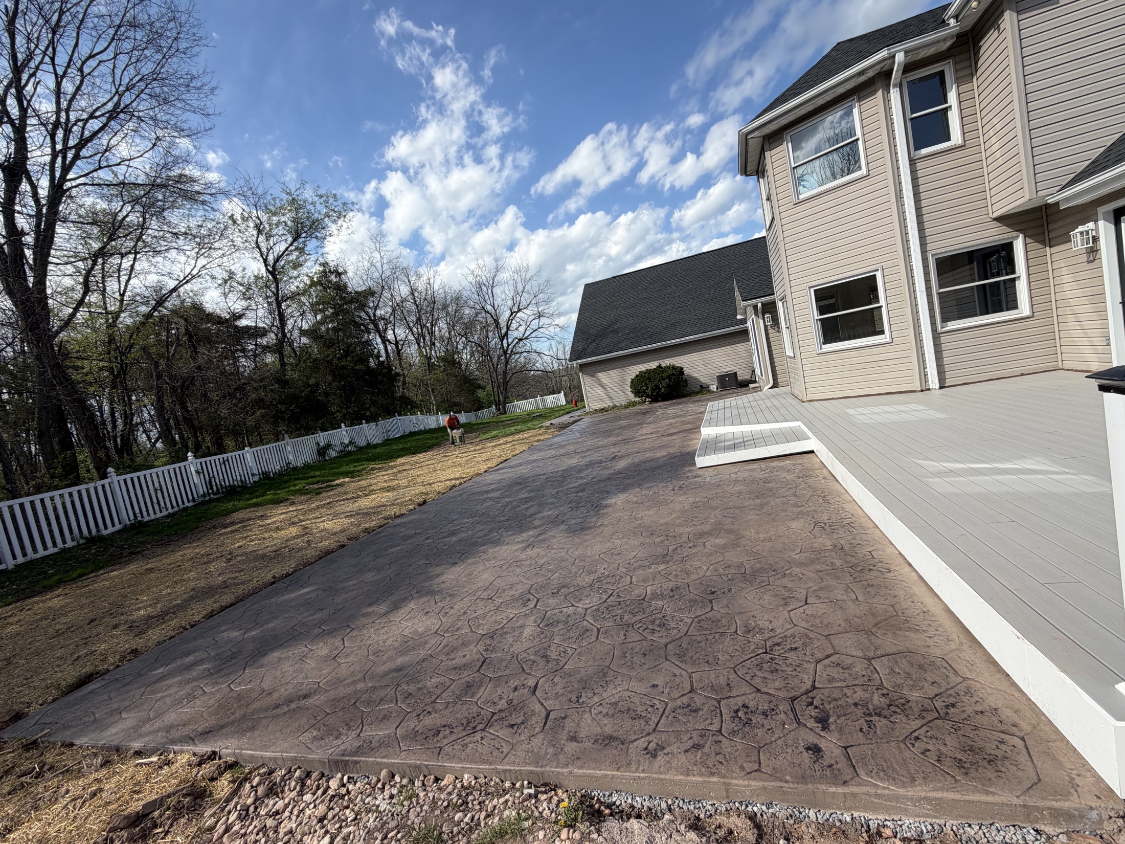 Large stamped backyard patio completed by T-Bones Concrete
