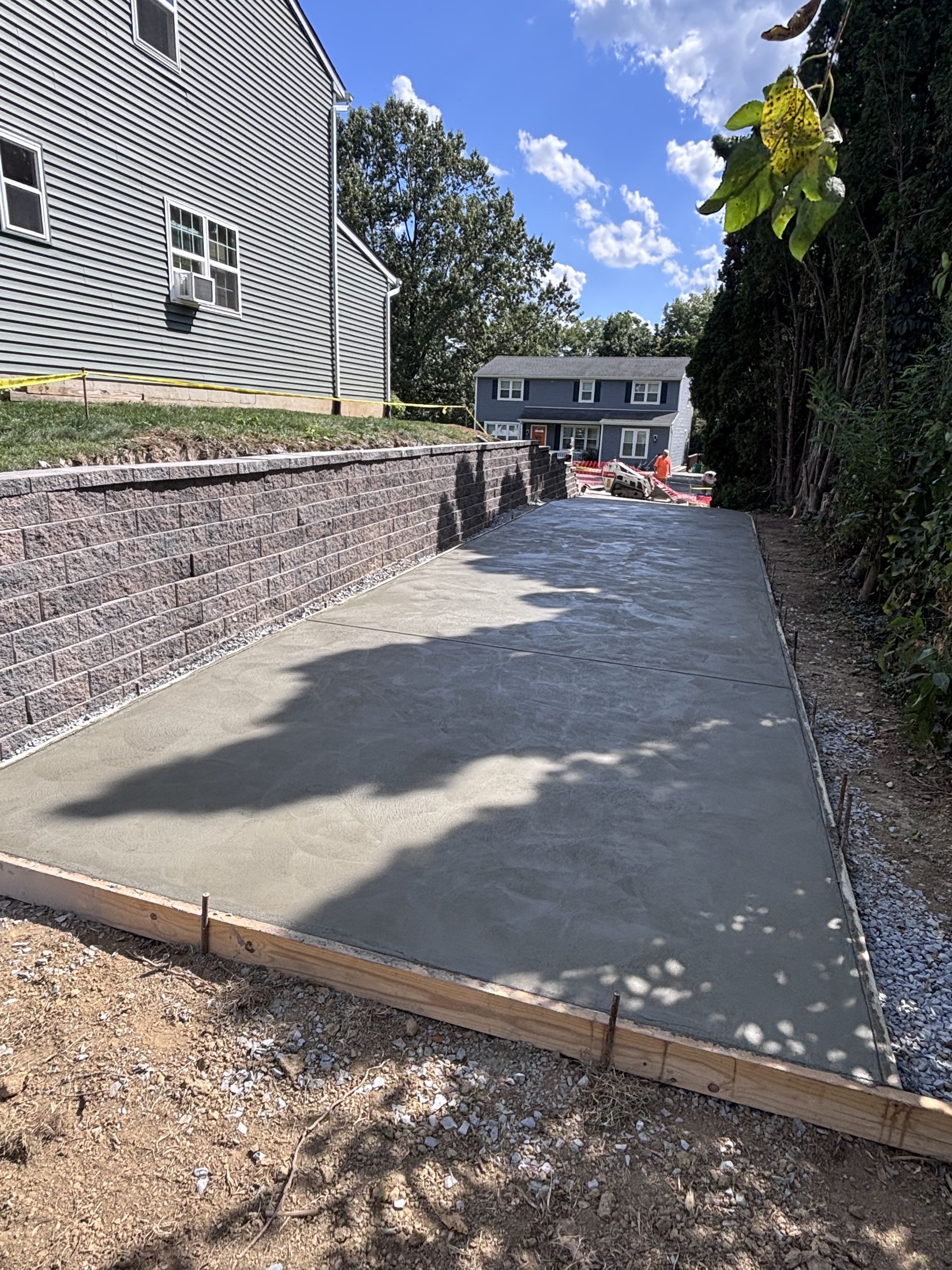 Concrete pad + retaining wall completed by T-Bones Concrete